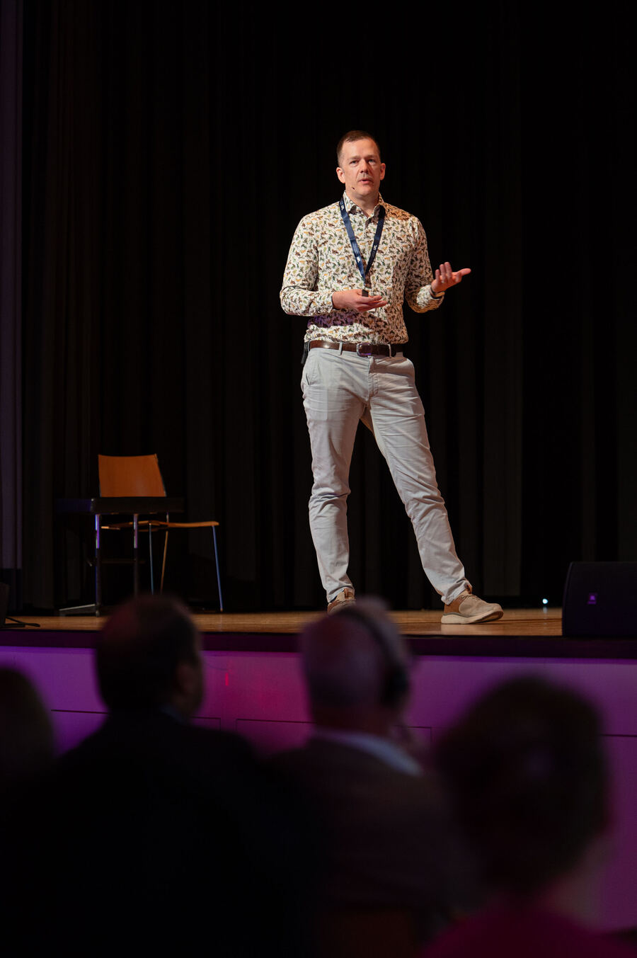 Mathias speaking on stage